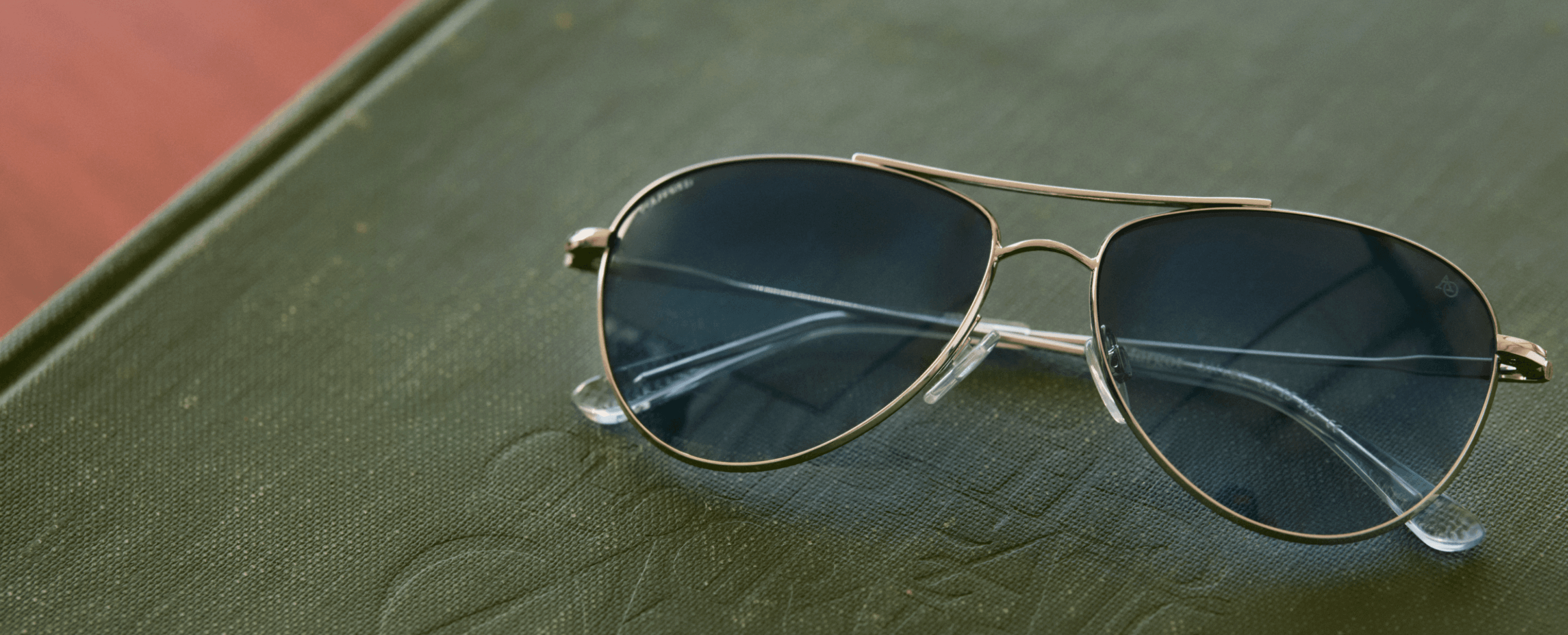 AO Sunglasses Pair on leather book